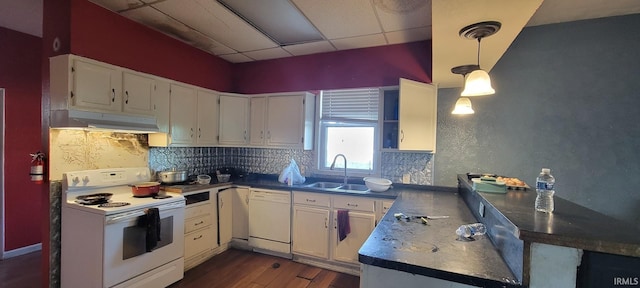 kitchen with decorative backsplash, white appliances, white cabinetry, under cabinet range hood, and a sink
