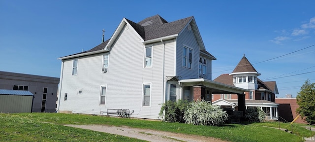 view of side of home featuring a yard