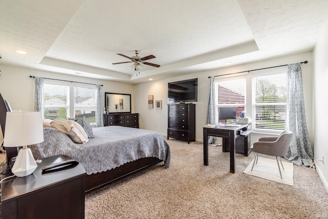bedroom featuring ceiling fan, a raised ceiling, baseboards, carpet, and recessed lighting
