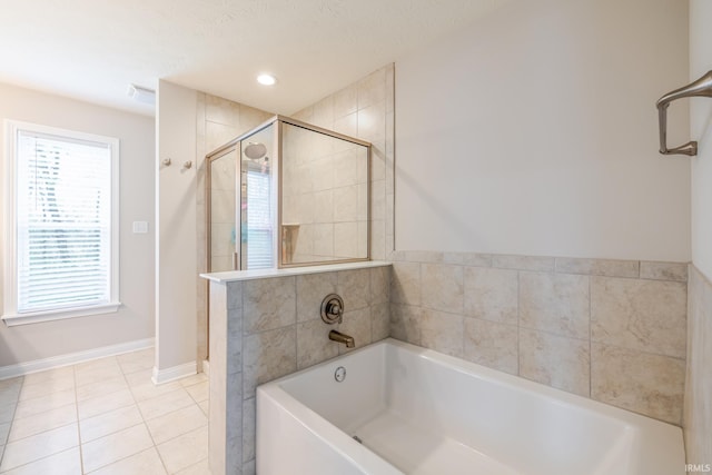 full bathroom with a garden tub, visible vents, a shower stall, tile patterned floors, and baseboards