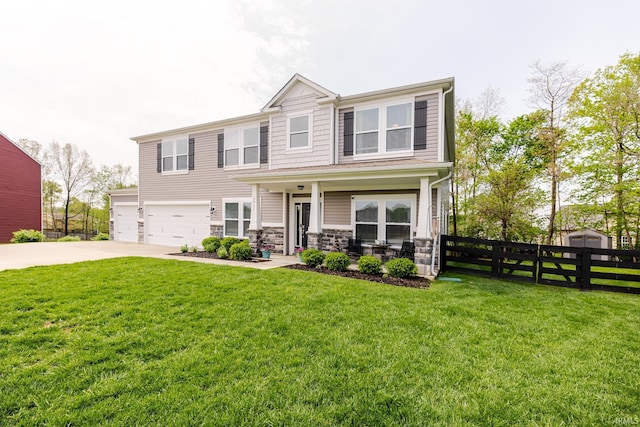 view of front of home featuring covered porch, fence, a front lawn, concrete driveway, and an attached garage