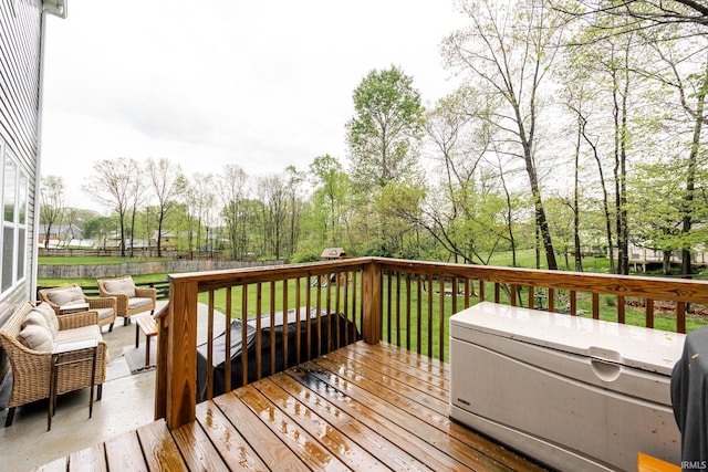 wooden terrace with a lawn and fence