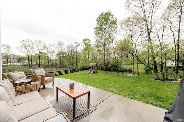 view of patio / terrace with fence, an outdoor hangout area, and a playground