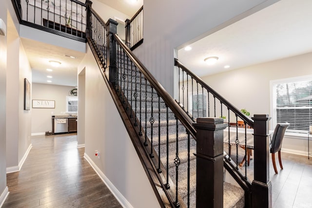 stairs featuring baseboards, recessed lighting, and hardwood / wood-style flooring
