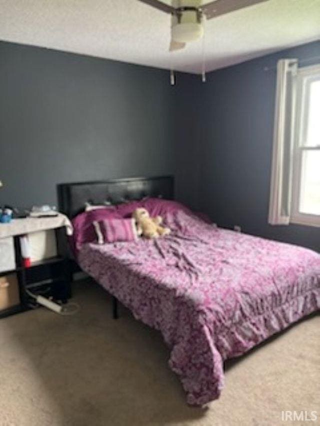 bedroom featuring a ceiling fan and carpet flooring