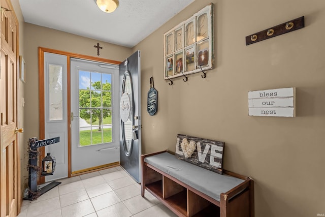 entryway with light tile patterned floors