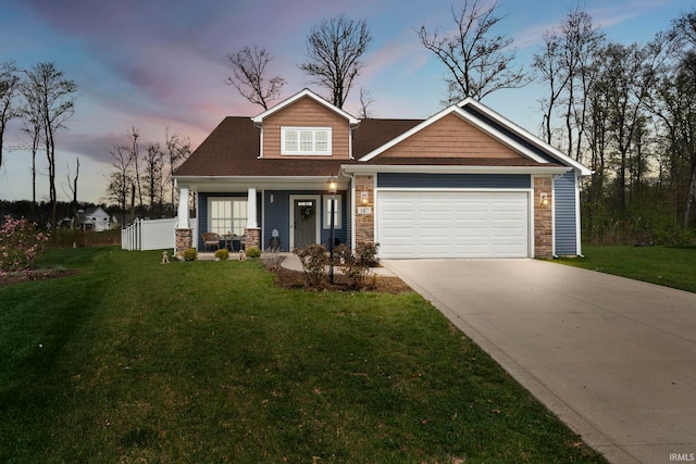craftsman house featuring a garage, a porch, a front lawn, and stone siding