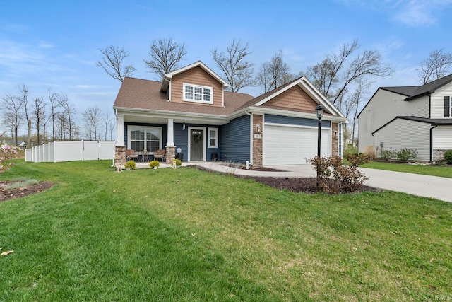 craftsman-style house featuring a garage, a front lawn, fence, concrete driveway, and a porch