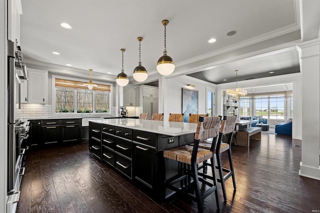 13341 Leesburg Rd, Fort Wayne, IN 46818 - kitchen featuring white cabinets, dark cabinets, dark wood finished floors, and a wealth of natural light