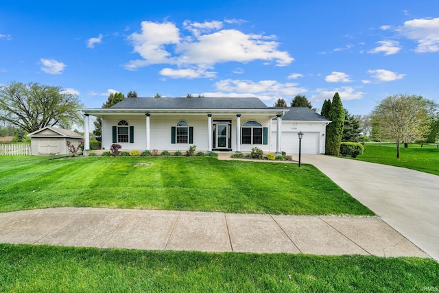 view of front of house with a porch, an attached garage, driveway, and a front lawn