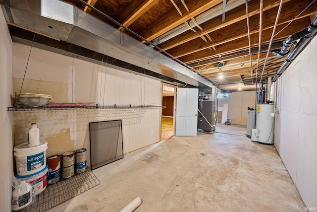 unfinished basement with heating unit and water heater