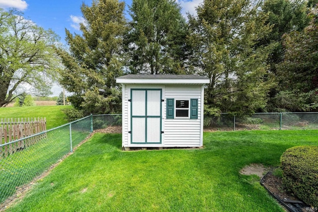 view of shed featuring a fenced backyard