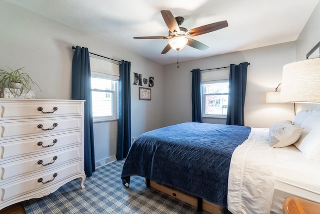 carpeted bedroom featuring a ceiling fan