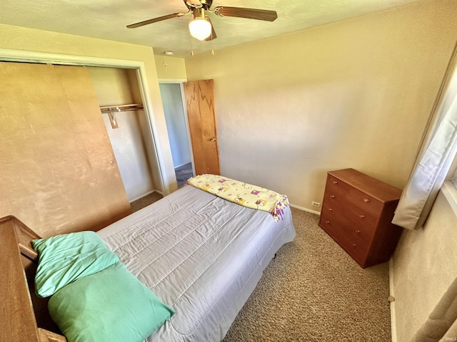 bedroom with carpet floors, a ceiling fan, baseboards, and a closet