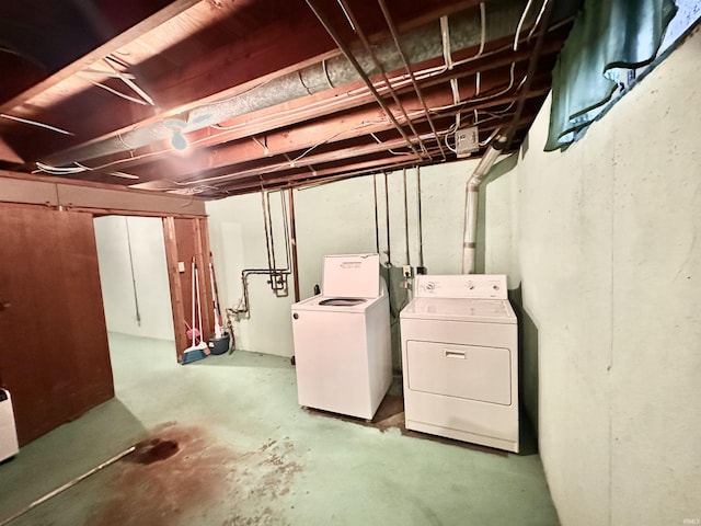 unfinished basement with washing machine and dryer