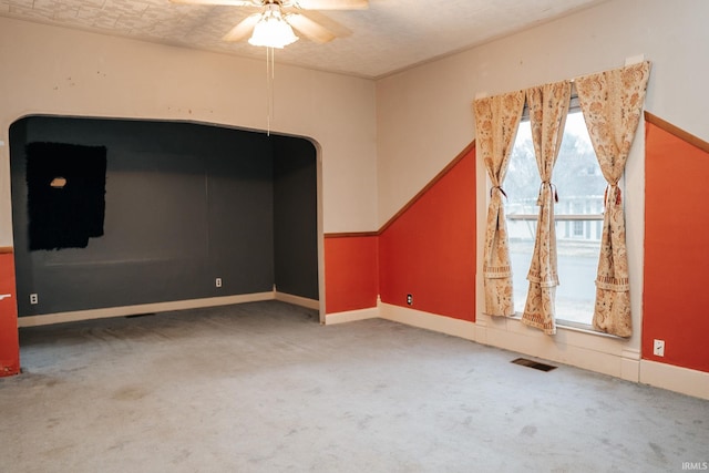 bonus room featuring carpet flooring, a ceiling fan, baseboards, and visible vents