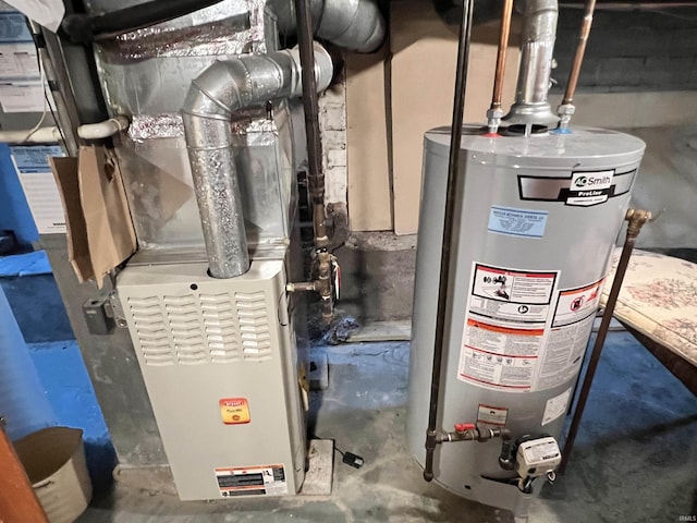 utility room featuring heating unit and water heater