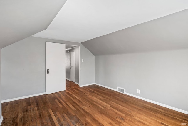 706 Ruse St, North Manchester, IN 46962 - additional living space featuring baseboards, vaulted ceiling, wood finished floors, and visible vents