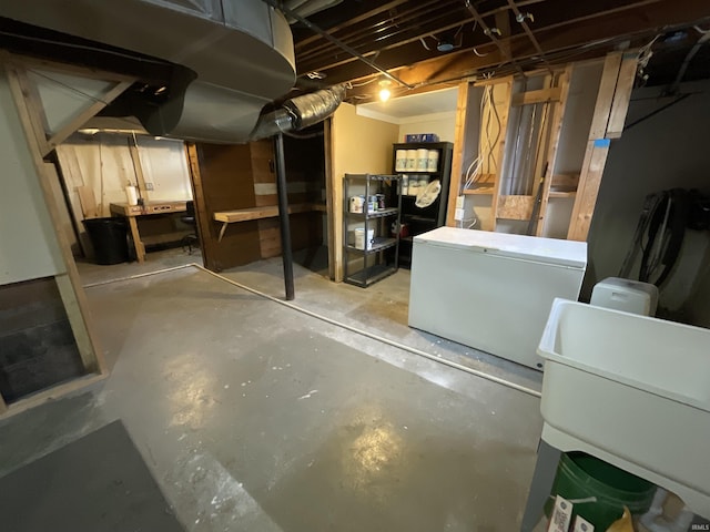 unfinished below grade area with fridge