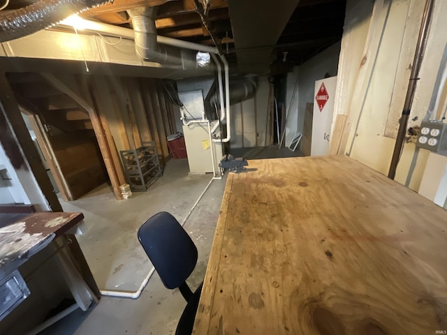 unfinished basement with heating unit