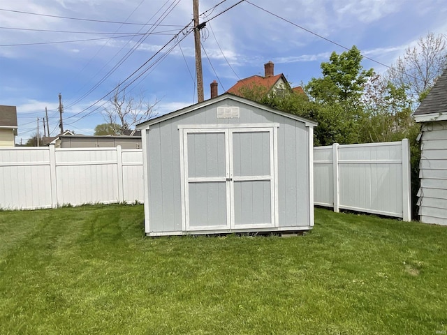 view of shed with fence