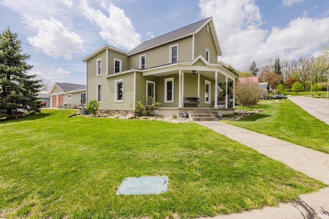 view of front of property with a porch and a front lawn