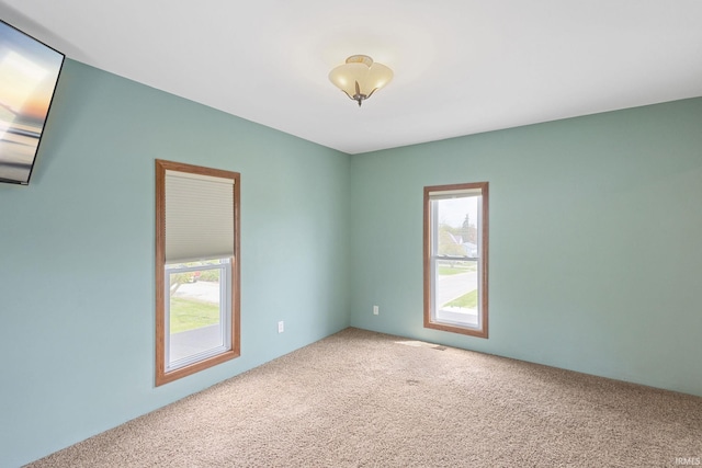 spare room featuring carpet flooring