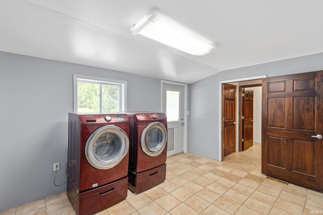 laundry room featuring washer and dryer, laundry area, and visible vents
