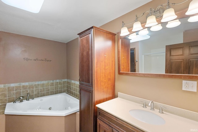 bathroom featuring a whirlpool tub and vanity