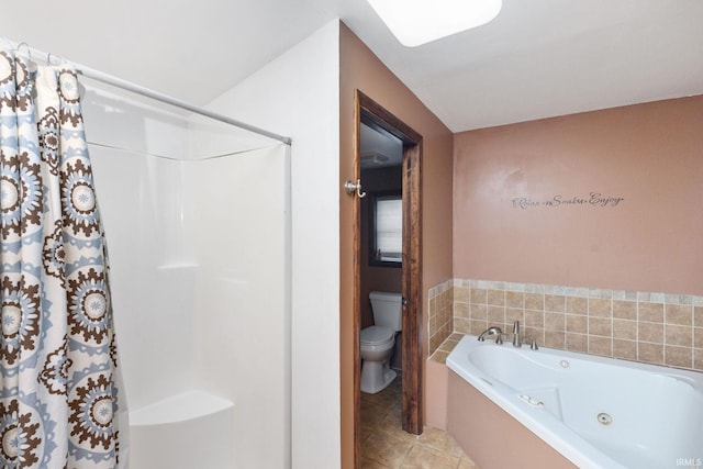 bathroom with toilet, a tub with jets, curtained shower, and tile patterned flooring