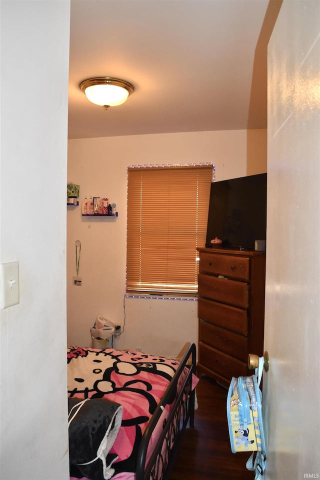 bedroom with wood finished floors