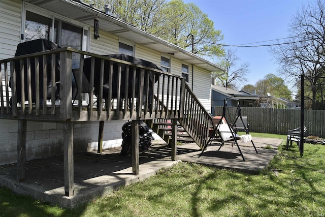 wooden terrace with stairway, a patio, and fence