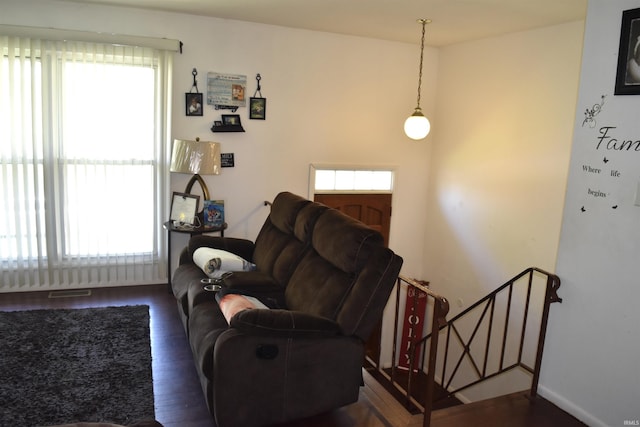 living room with visible vents and wood finished floors
