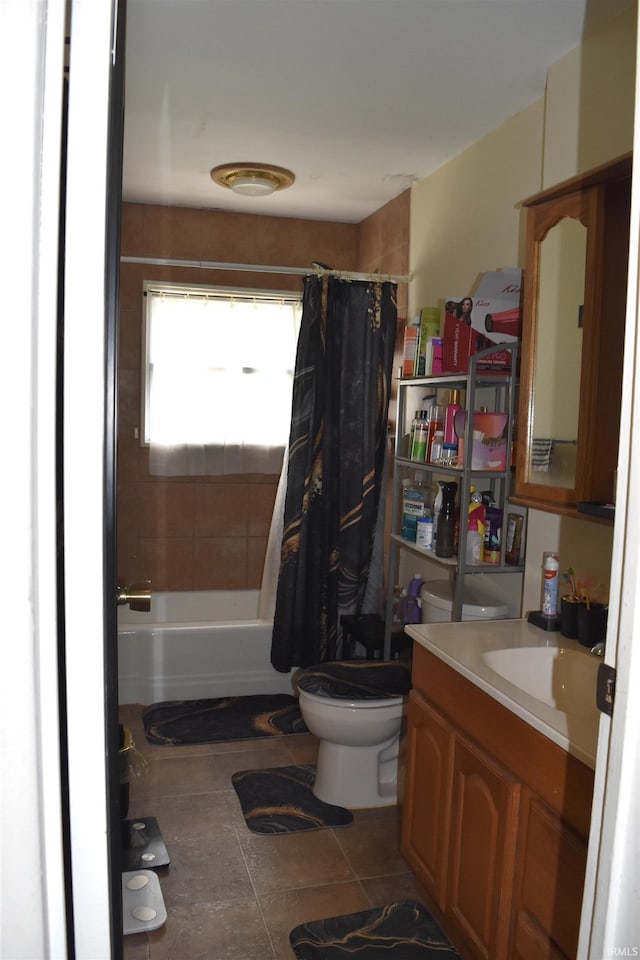 full bathroom featuring tile patterned floors, vanity, toilet, and shower / tub combo
