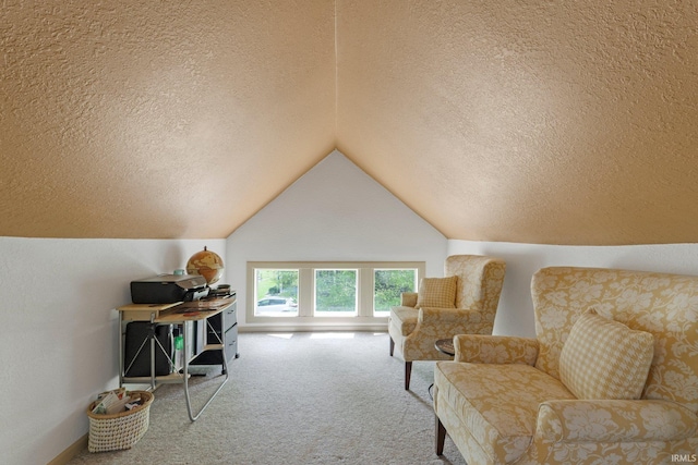 sitting room featuring carpet flooring, a textured ceiling, and lofted ceiling