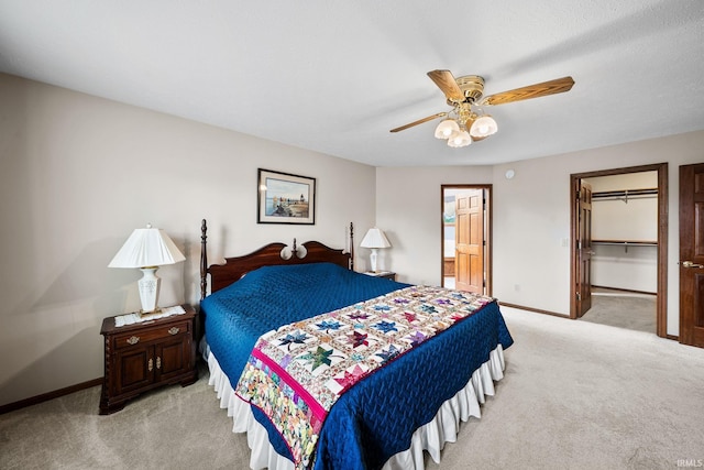 14157 Tenbury Dr, Granger, IN 46530 - bedroom with a ceiling fan, ensuite bathroom, baseboards, light colored carpet, and a spacious closet