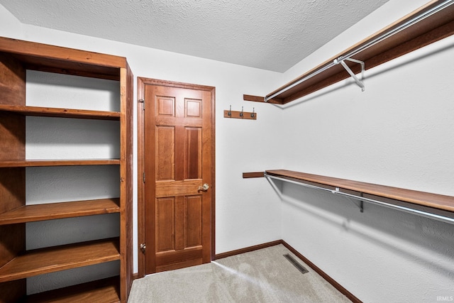 14157 Tenbury Dr, Granger, IN 46530 - walk in closet featuring visible vents and carpet floors
