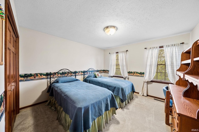 14157 Tenbury Dr, Granger, IN 46530 - bedroom with a textured ceiling, carpet, and baseboards