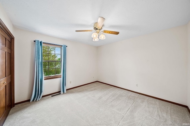 14157 Tenbury Dr, Granger, IN 46530 - empty room featuring light colored carpet, baseboards, ceiling fan, and visible vents