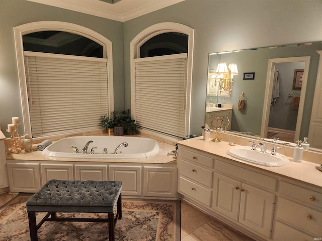 bathroom with tile patterned floors, a tub with jets, ornamental molding, and vanity