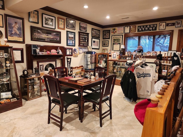 dining room featuring recessed lighting and ornamental molding