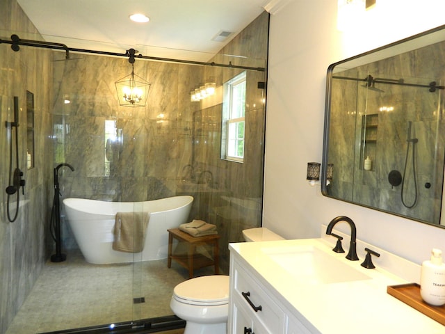 bathroom with vanity, a freestanding tub, toilet, tile walls, and a shower stall