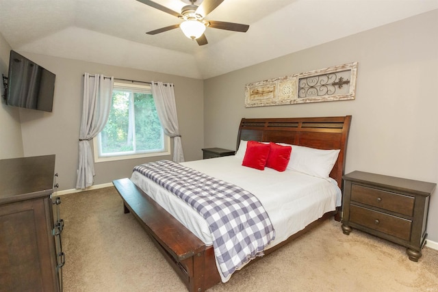 bedroom featuring baseboards, a ceiling fan, and light colored carpet