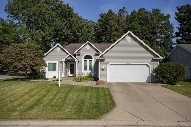 single story home featuring an attached garage, a front lawn, and concrete driveway