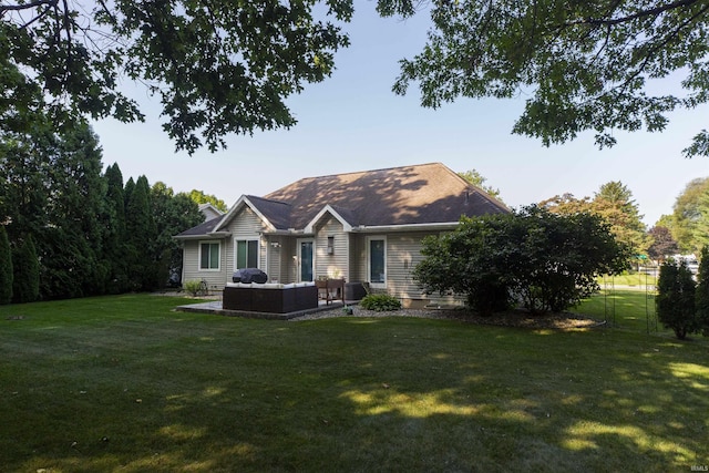 rear view of property with a lawn, outdoor lounge area, a chimney, and a patio