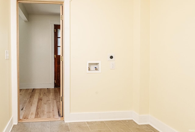 washroom featuring baseboards, hookup for an electric dryer, laundry area, and hookup for a washing machine