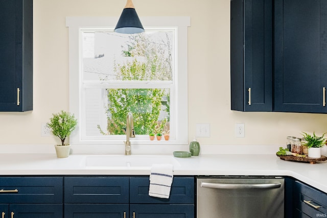 kitchen featuring a sink, blue cabinetry, dishwasher, and light countertops