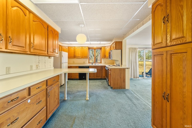 kitchen featuring carpet flooring, electric range, light countertops, brown cabinetry, and a paneled ceiling