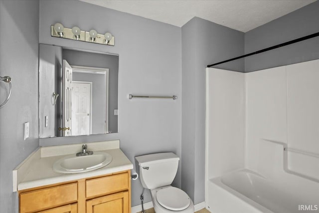 bathroom with toilet, a textured ceiling, shower / tub combination, and vanity