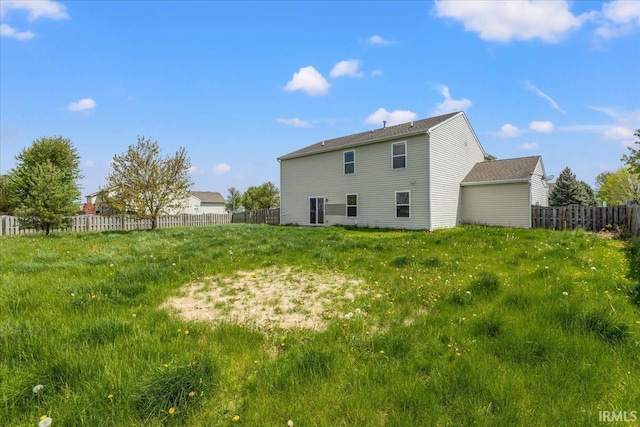 back of property featuring fence